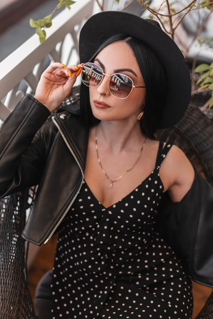 Modern Feminine Woman in Fashionable Hat in Luxurious Black Dres